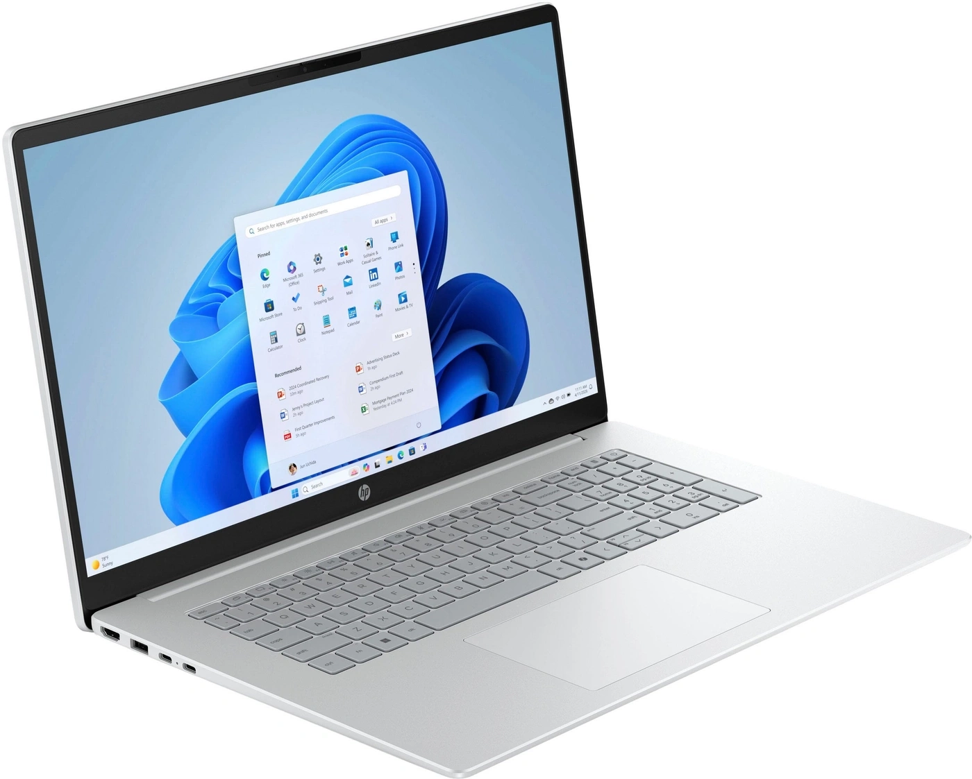 Ein silberner HP Laptop mit Windows 11 und einem aufgeklappten Menü auf dem Bildschirm.