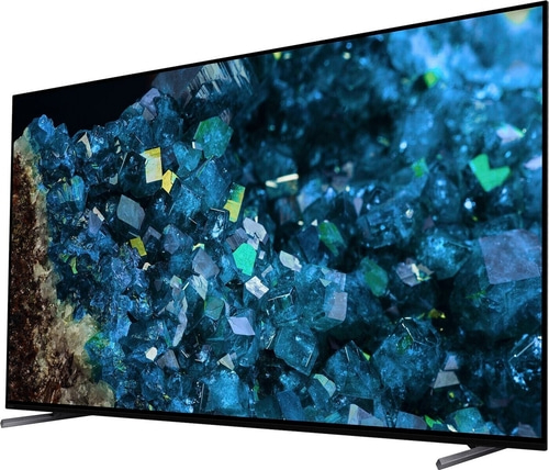Fernseher mit blauem Kristallmuster, schwarzem Rahmen und silbernen Füßen