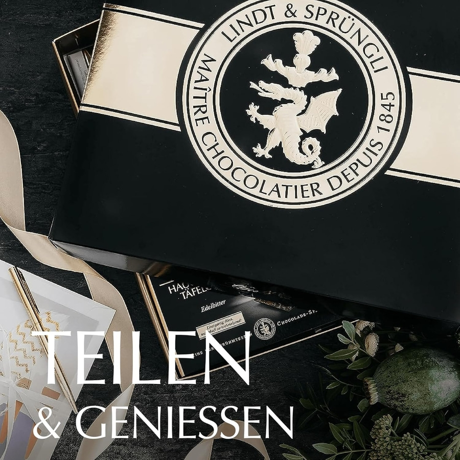 Lindt & Sprüngli Pralinen-Box mit Band und Blumen