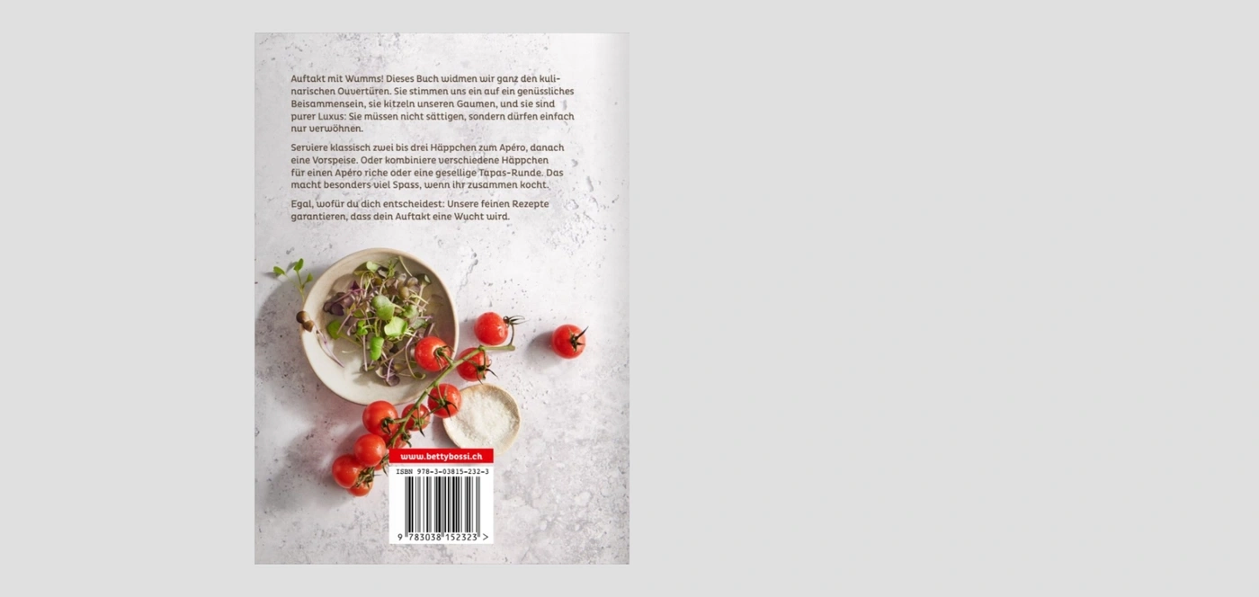 Ein Buch mit Rezepten für Vorspeisen und Häppchen, mit Tomaten und Salat.