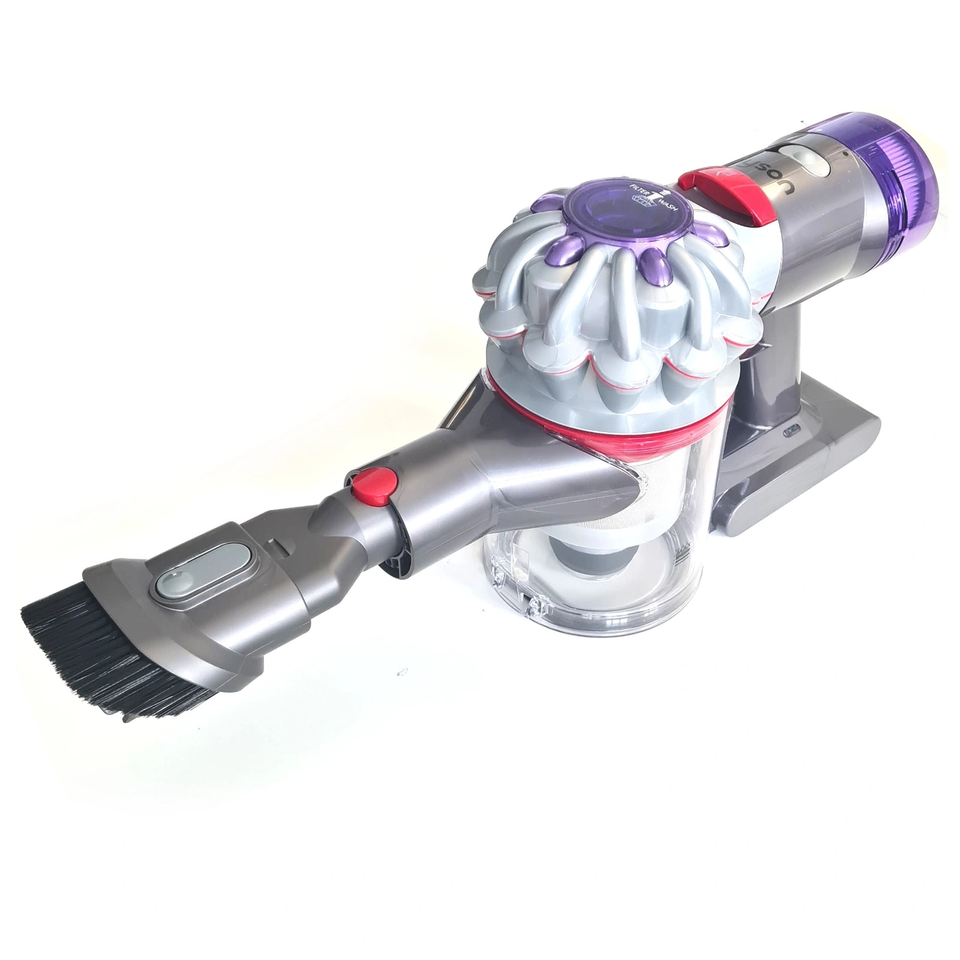 Ein Dyson Akku-Staubsauger mit Bürstenaufsatz auf weißem Hintergrund.