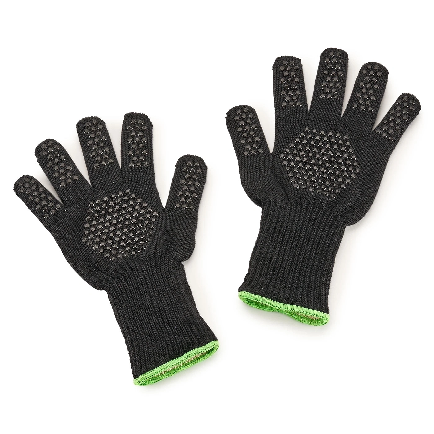 Schwarze Handschuhe mit grünen Rändern und rutschfesten Punkten auf weißem Hintergrund.
