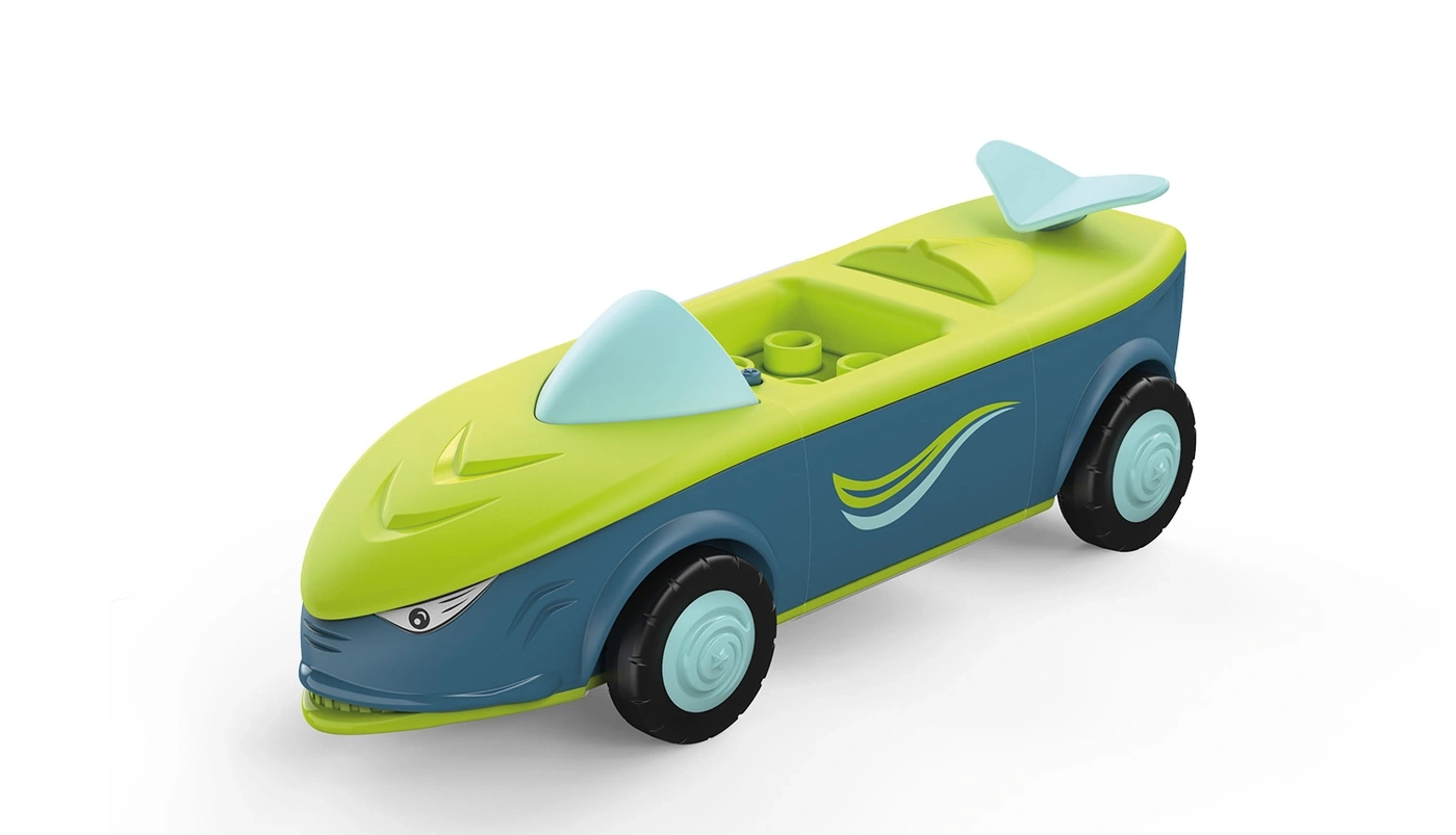 Ein grünes und blaues Spielzeugauto mit einem Hai-Design und Flügeln.