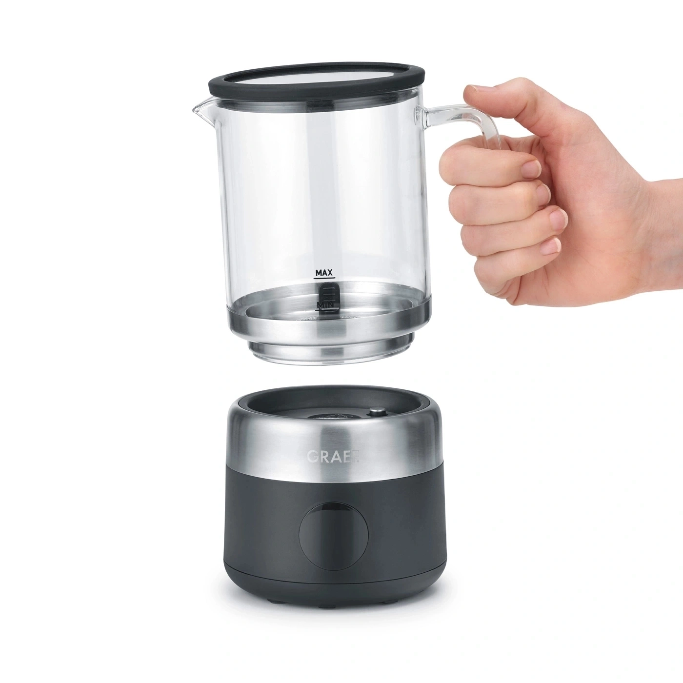 Eine Hand hält einen Glasbehälter über einer Basis mit dem Namen GRAEF