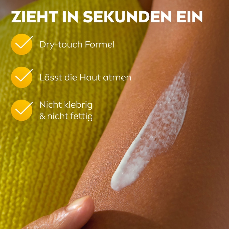 Creme auf Haut, Text: Zieht in Sekunden ein, Dry-touch Formel, atmungsaktiv, nicht fettig