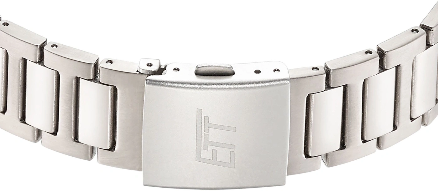 Ein detaillierter Blick auf ein silbernes Uhrenarmband mit einem stilisierten Logo.