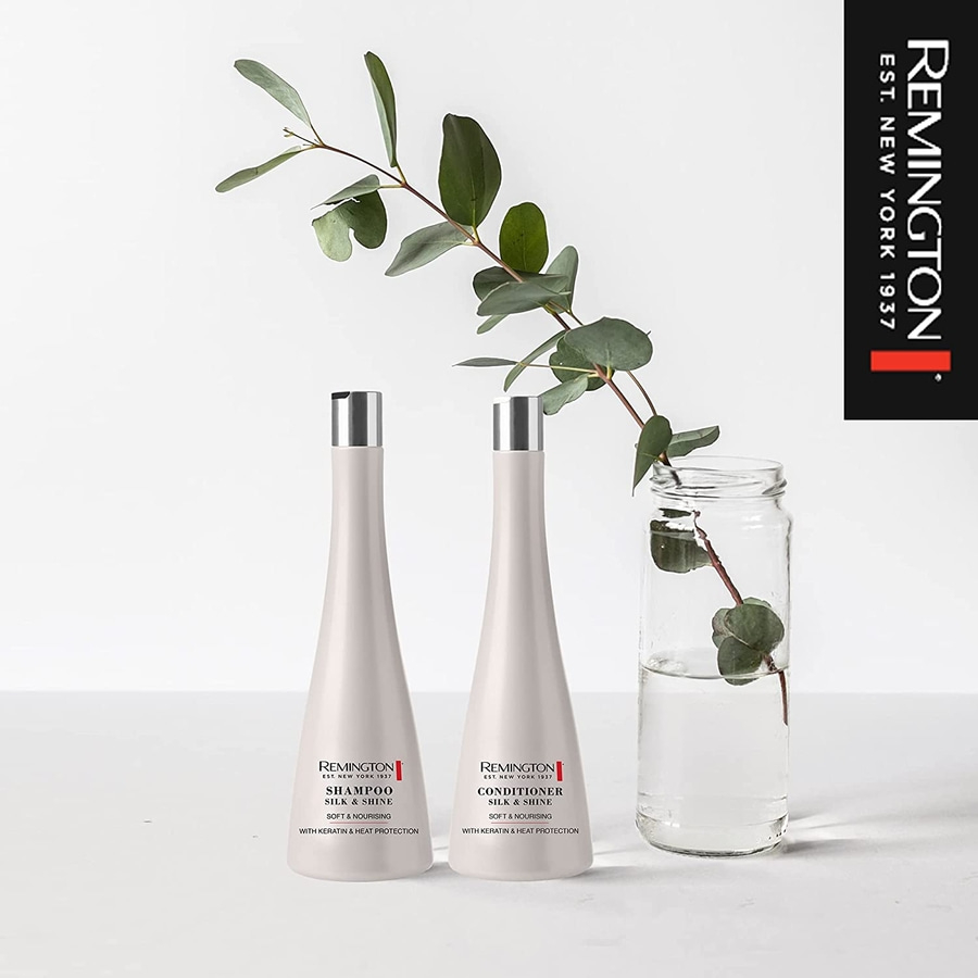 Zwei Remington Shampoo- und Conditioner-Flaschen mit Blättern und Glas