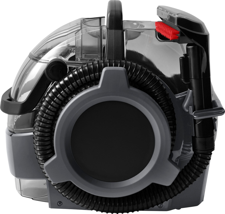 Ein tragbarer Teppichreiniger mit transparentem Tank und schwarzem Schlauch.