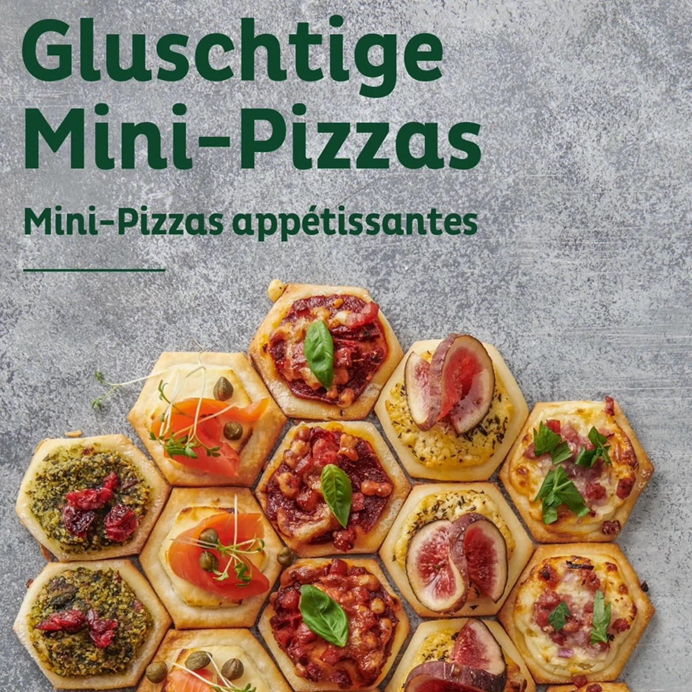 Gluschtige Mini-Pizzas, appetitlich angerichtet, mit verschiedenen Belägen auf grauem Hintergrund.