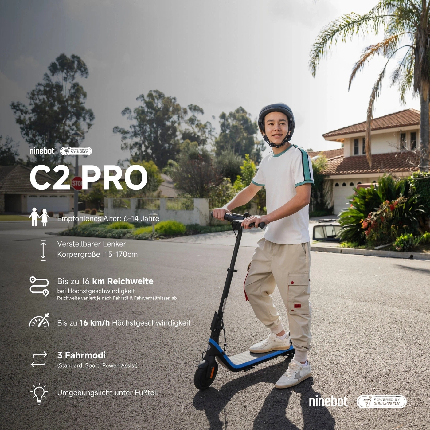 Ein Junge mit Helm fährt einen Ninebot C2 Pro E-Scooter auf einer Straße.