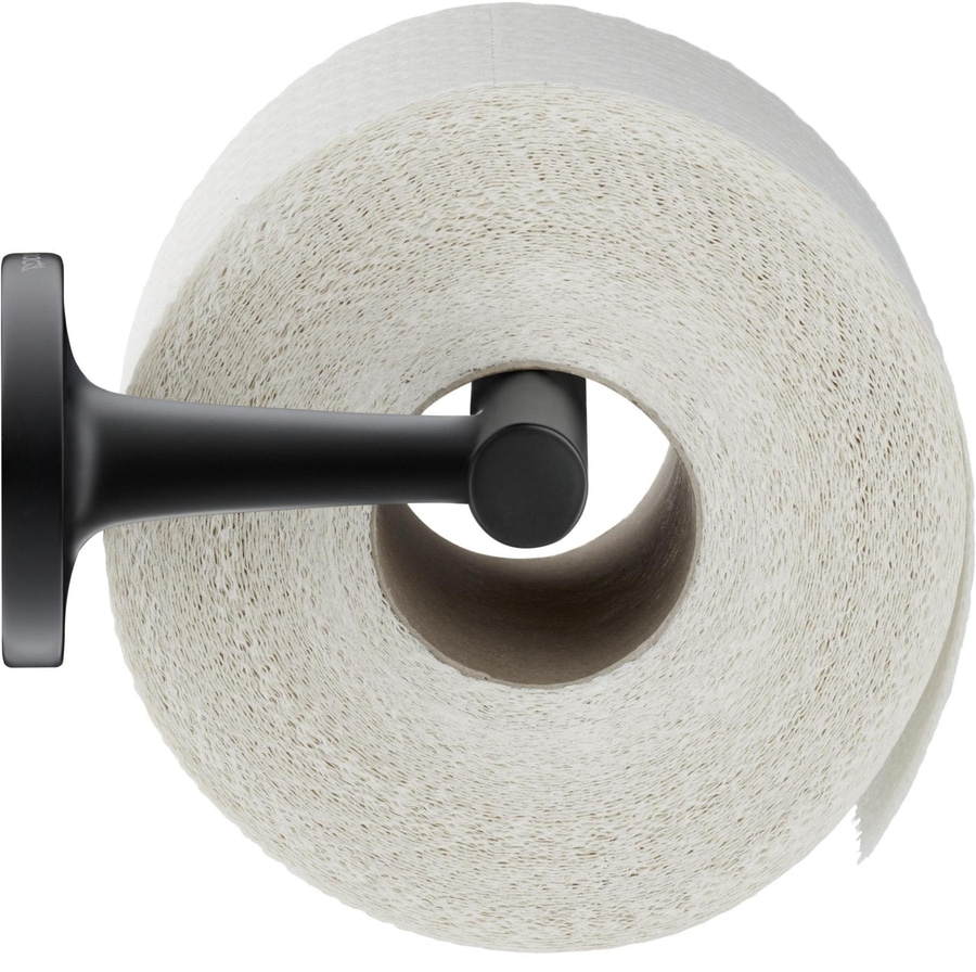 Toilettenpapierrolle auf schwarzem Halter, Nahaufnahme, weißes Papier, Badezimmer