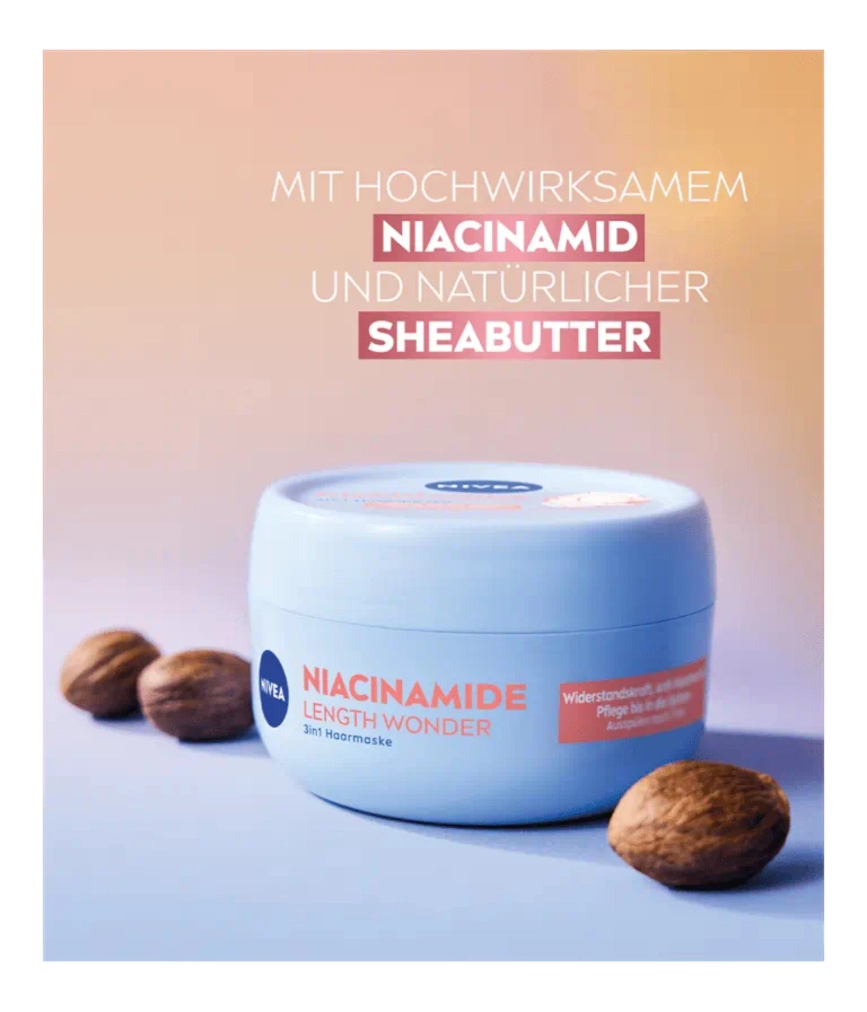 Nivea Haarmakse mit Niacinamid und Sheabutter auf rosafarbenem Hintergrund