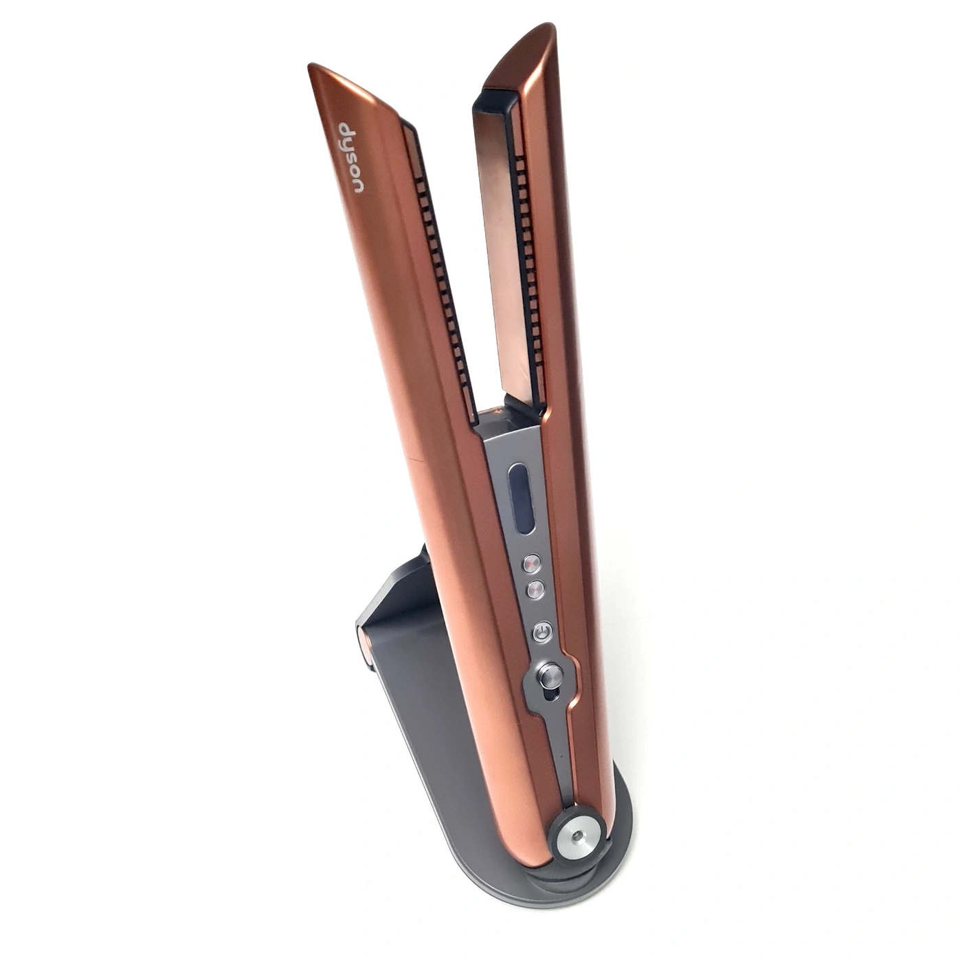 Ein bronzener Dyson Haarglätter auf einem Ständer