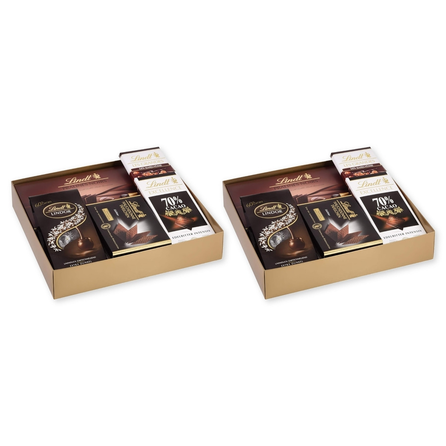 Zwei goldene Geschenkboxen mit Lindt Schokoladen, eine links und eine rechts.
