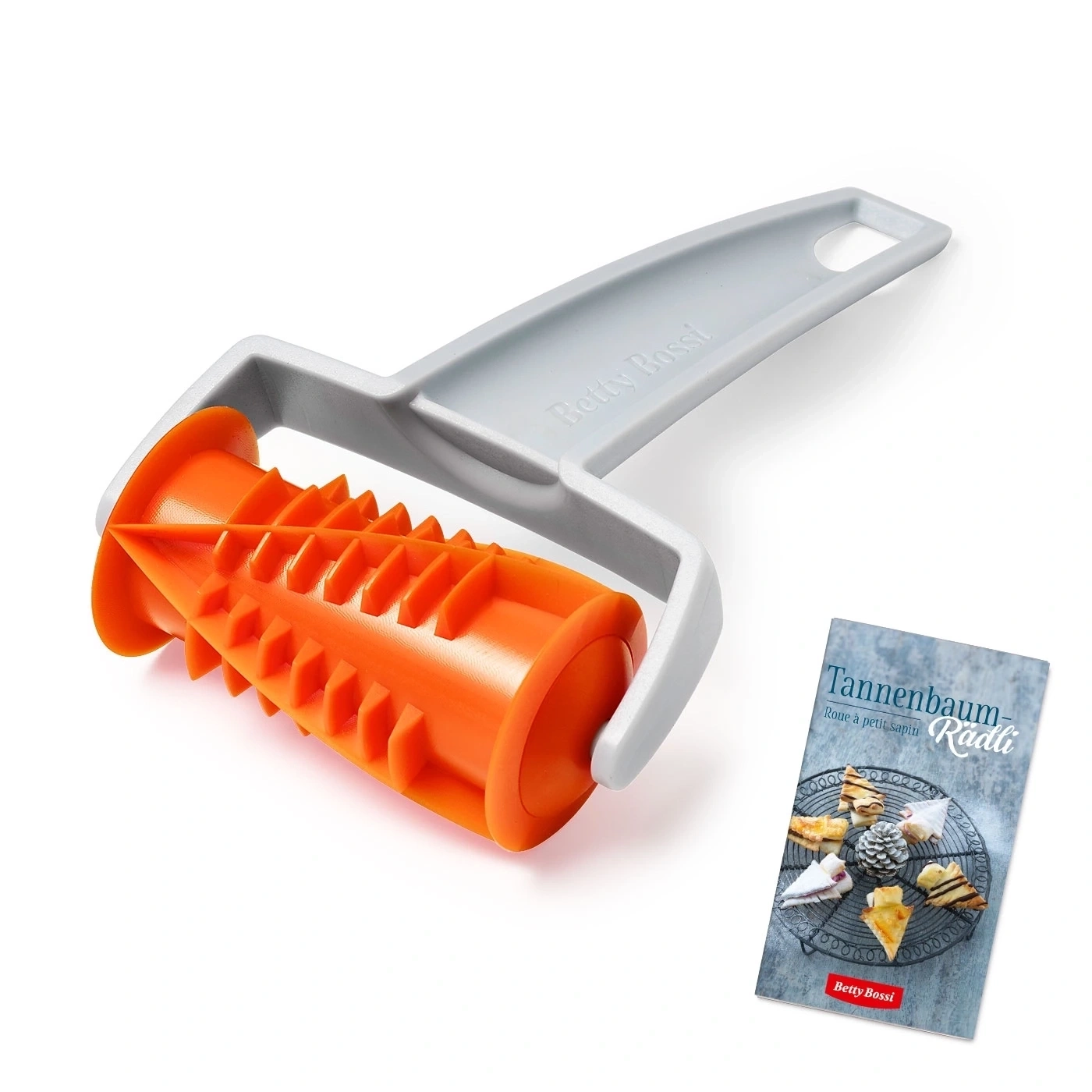 Orange Backrolle mit grauem Griff und einem Kochbuch mit Gebäck.