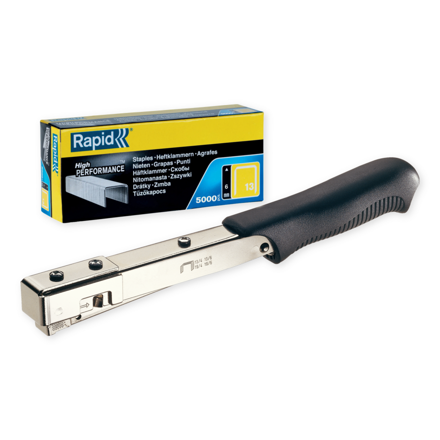 Ein silberner Tacker mit schwarzem Griff und einer Schachtel Heftklammern daneben.