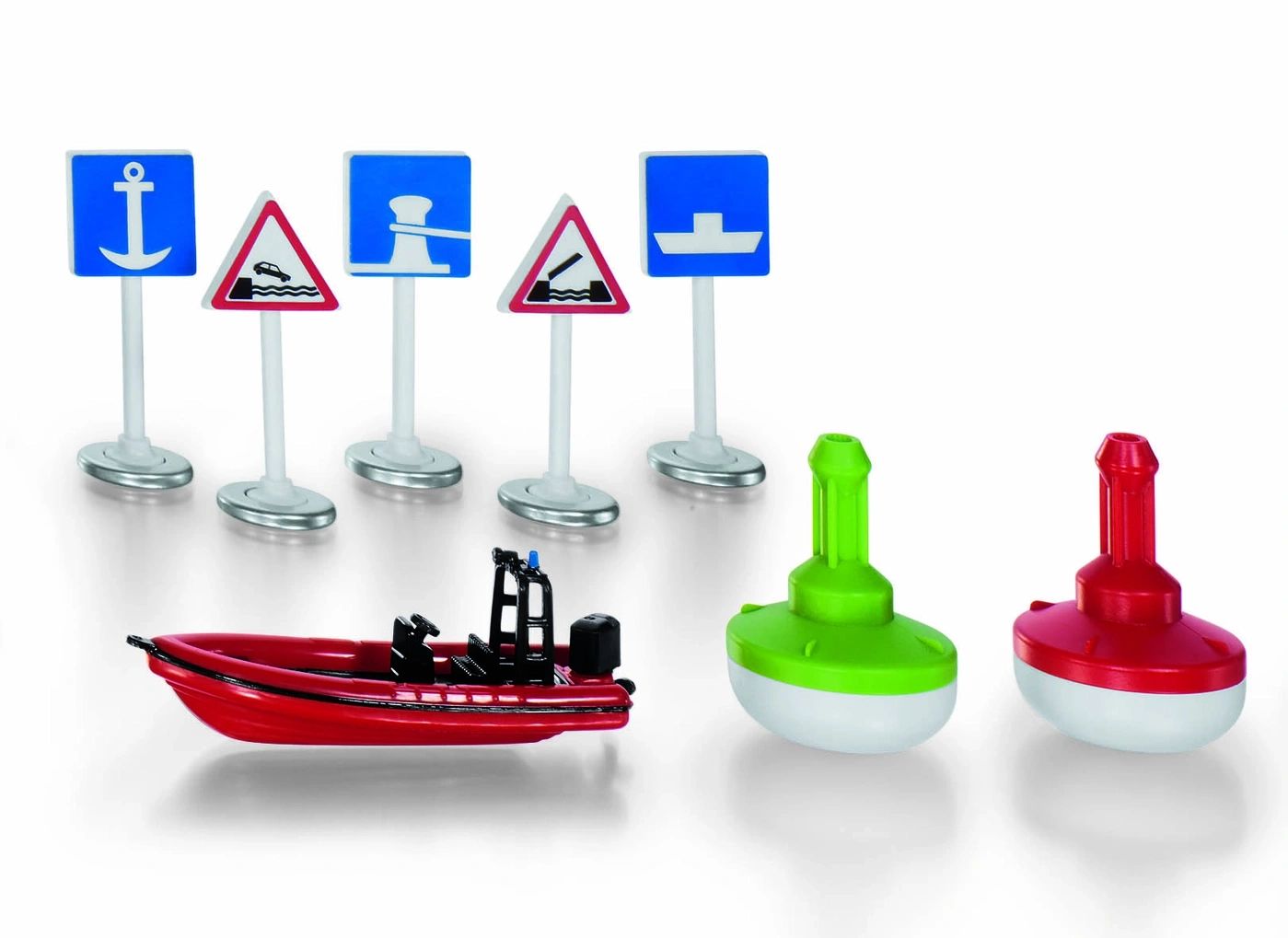 Spielzeug-Boote, Bojen und Verkehrsschilder auf weißem Hintergrund