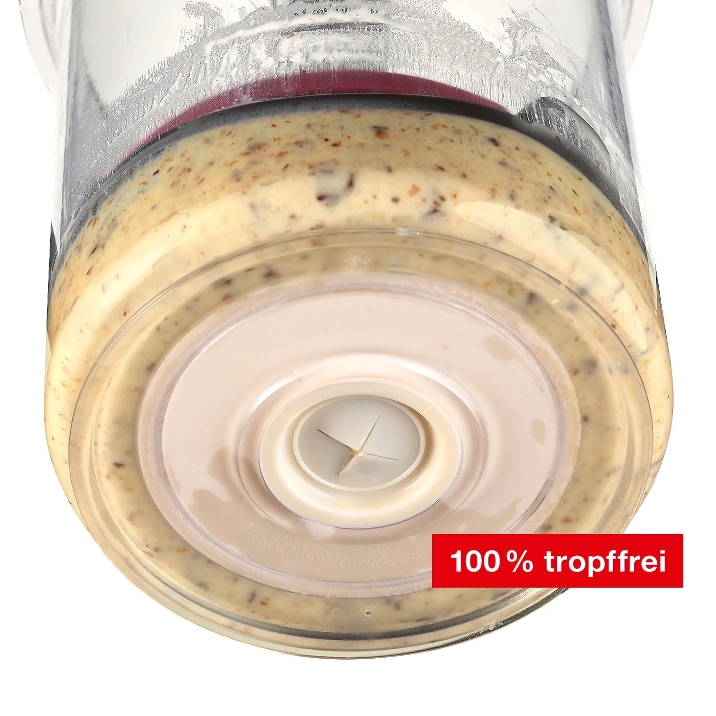 Nahaufnahme eines Mixbehälters mit Sauce, Text: 100 % tropffrei