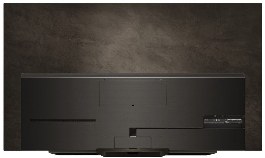 Rückseite eines schwarzen Fernsehers mit Anschlüssen und einem dunklen Hintergrund.