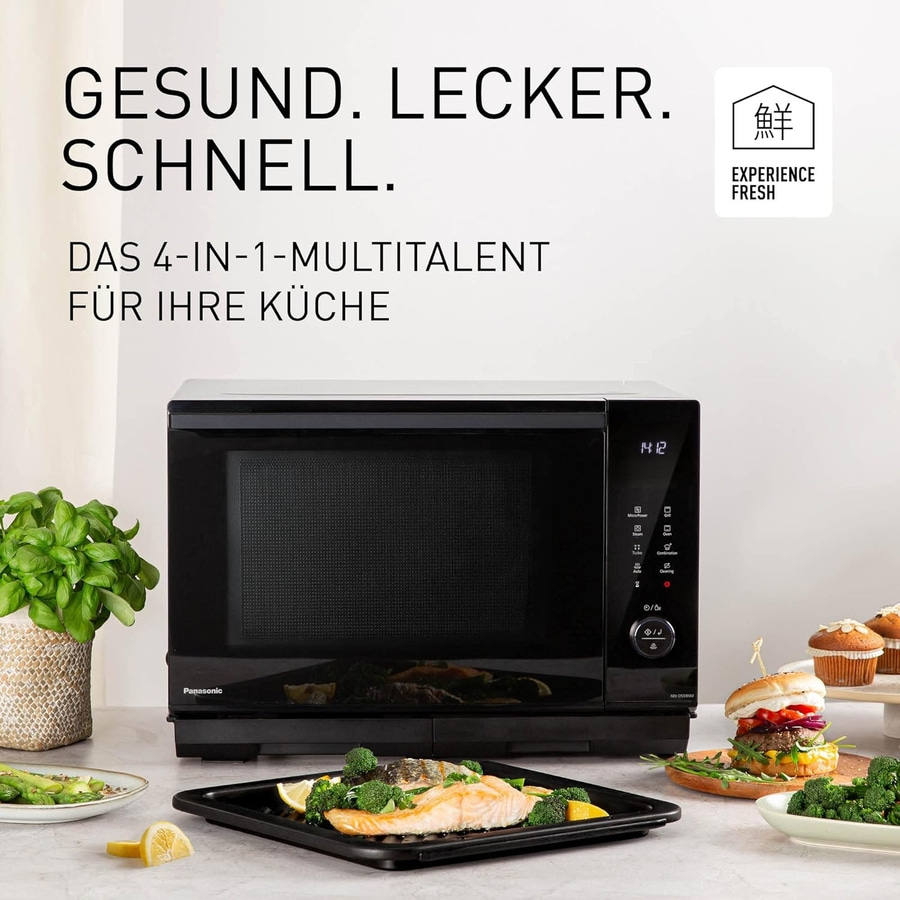 Schwarze Mikrowelle mit Essen, Text und Logo. Gesund, lecker, schnell.