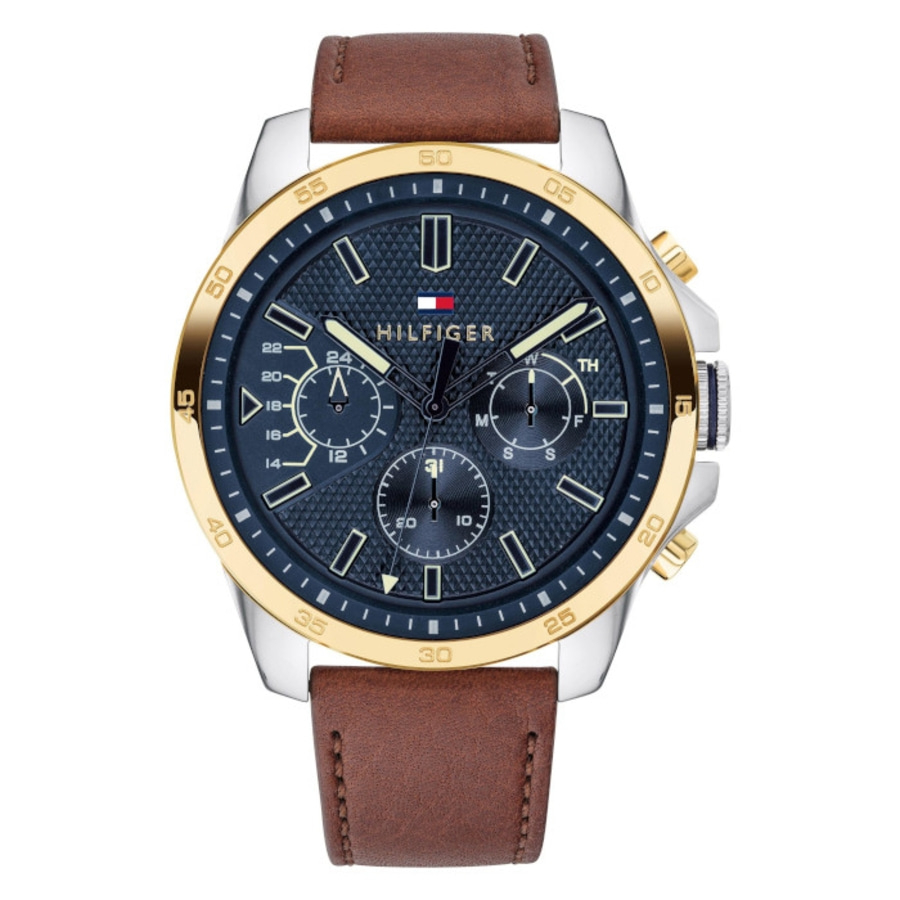 Eine Tommy Hilfiger Uhr mit braunem Lederarmband und blauem Zifferblatt.
