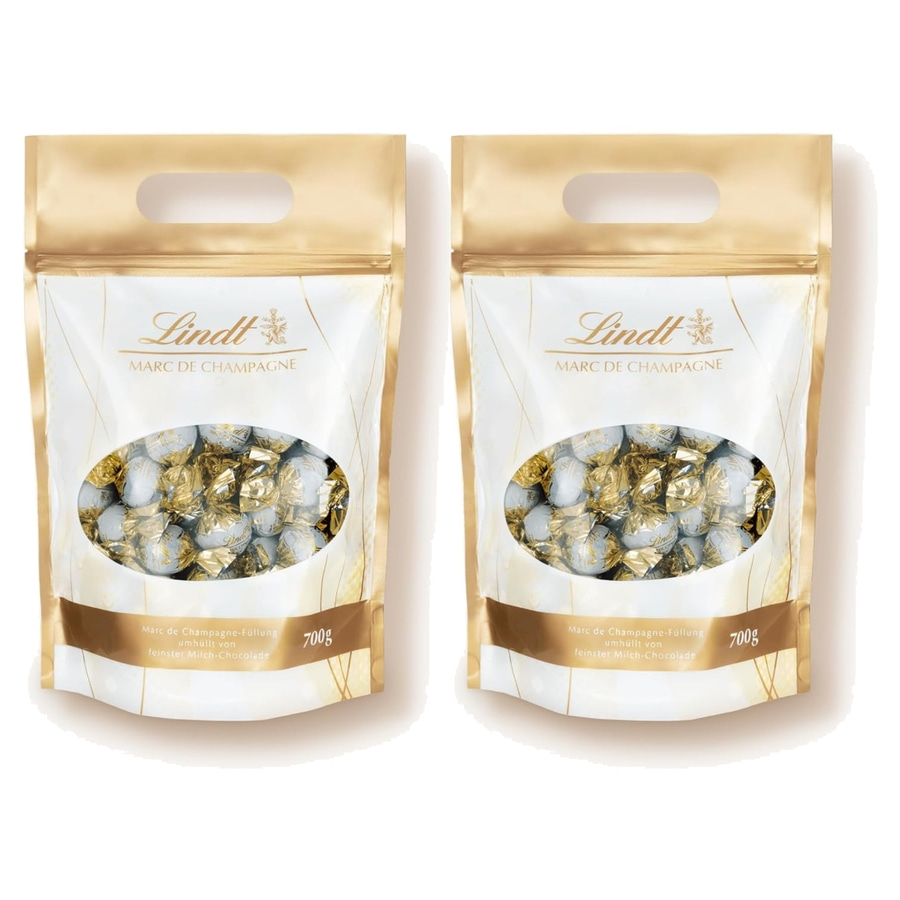 Zwei goldene Lindt Päckchen gefüllt mit Marc de Champagne Pralinen