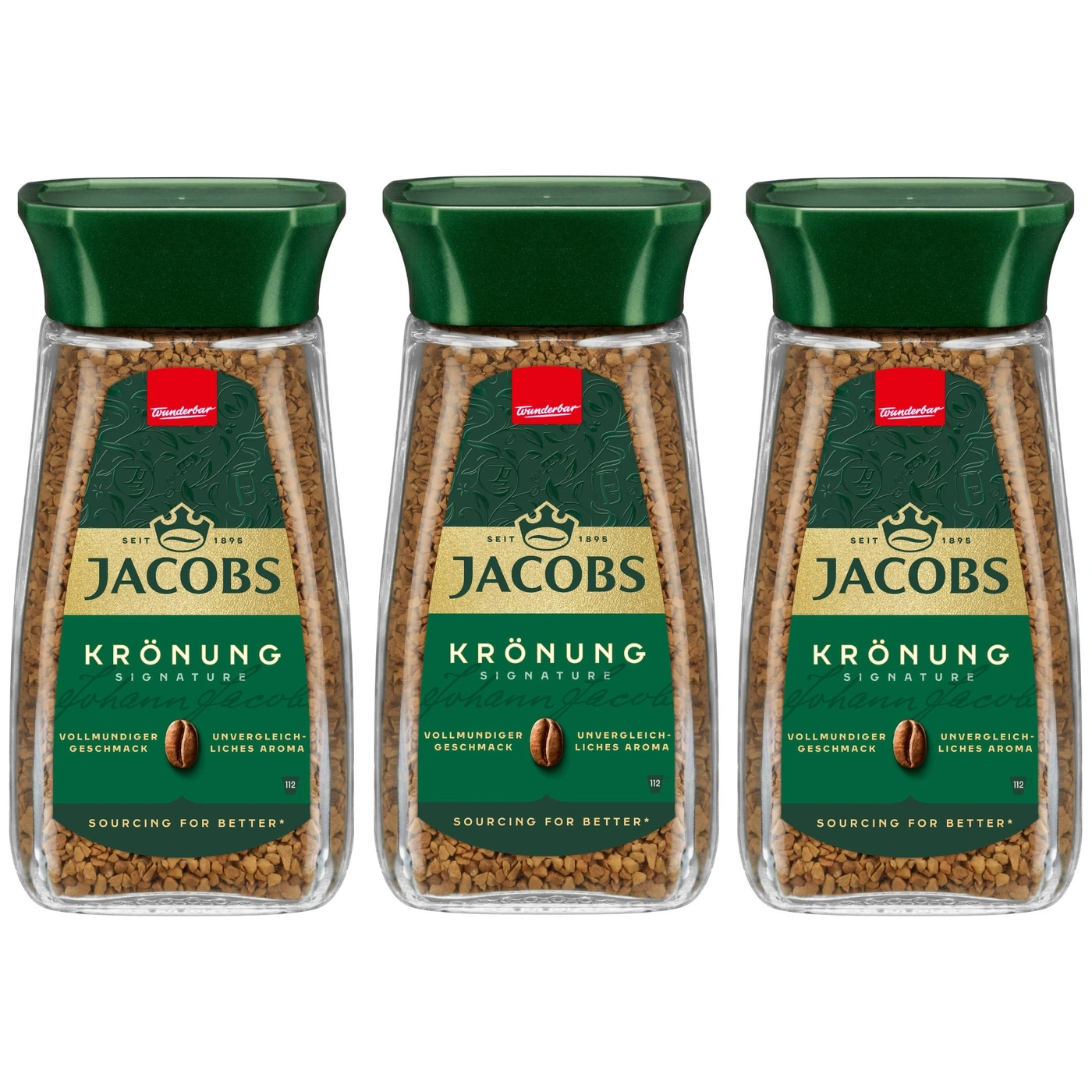 Drei Gläser Jacobs Krönung Kaffee mit grünem Deckel und Etikett.
