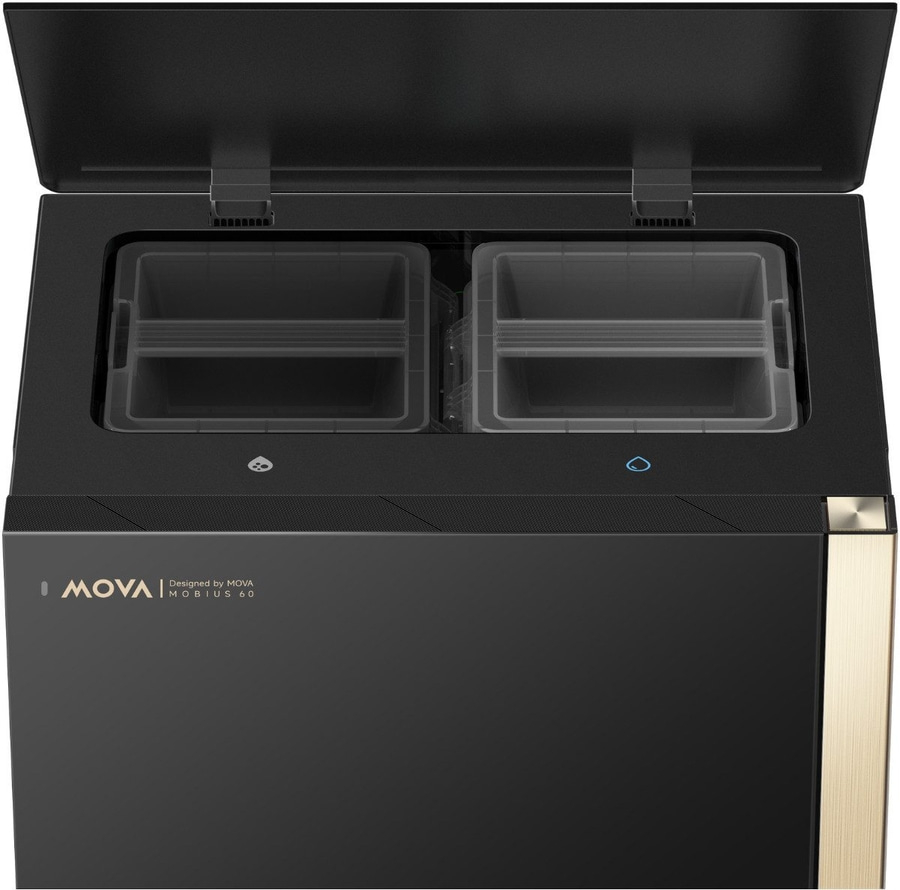 Ein schwarzer und goldener MOVA Mobius 60 mit zwei offenen Frchen.