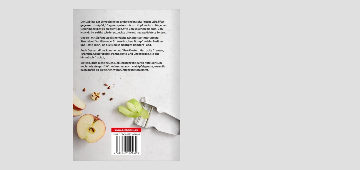 Ein Kochbuch mit Apfelrezepten und einem Bild von Äpfeln und Sparschäler.
