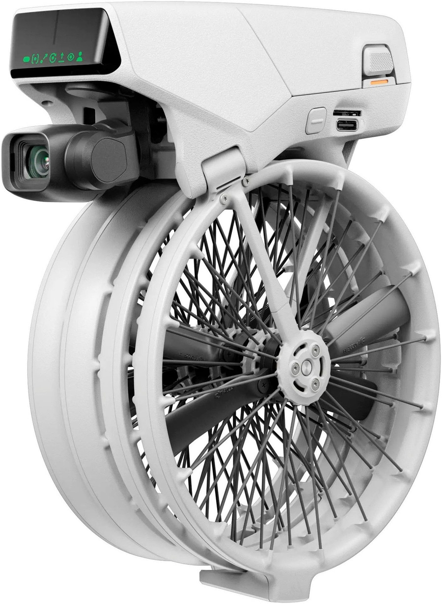 Eine weiße Drohne mit zwei Rädern und einer Kamera vorne.