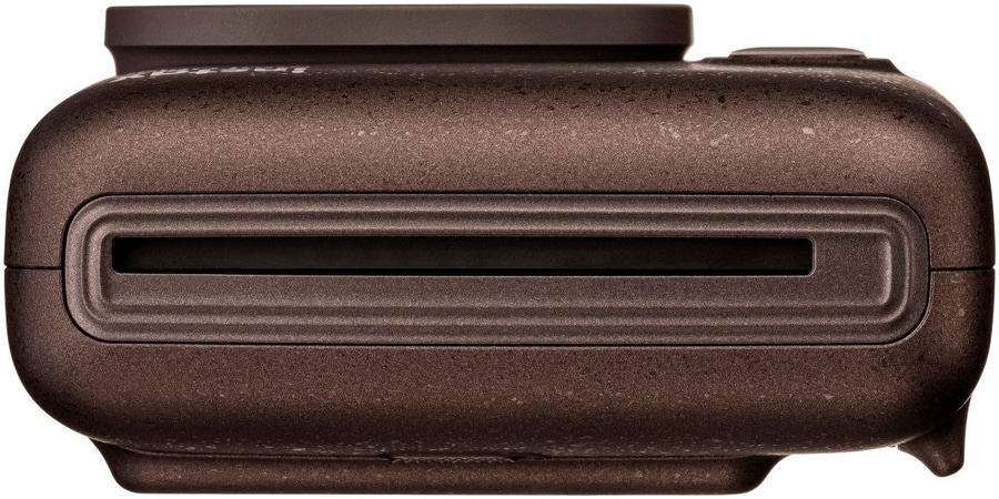 Dunkelbraune Kamera mit Schlitz und aufgesetztem Teil.