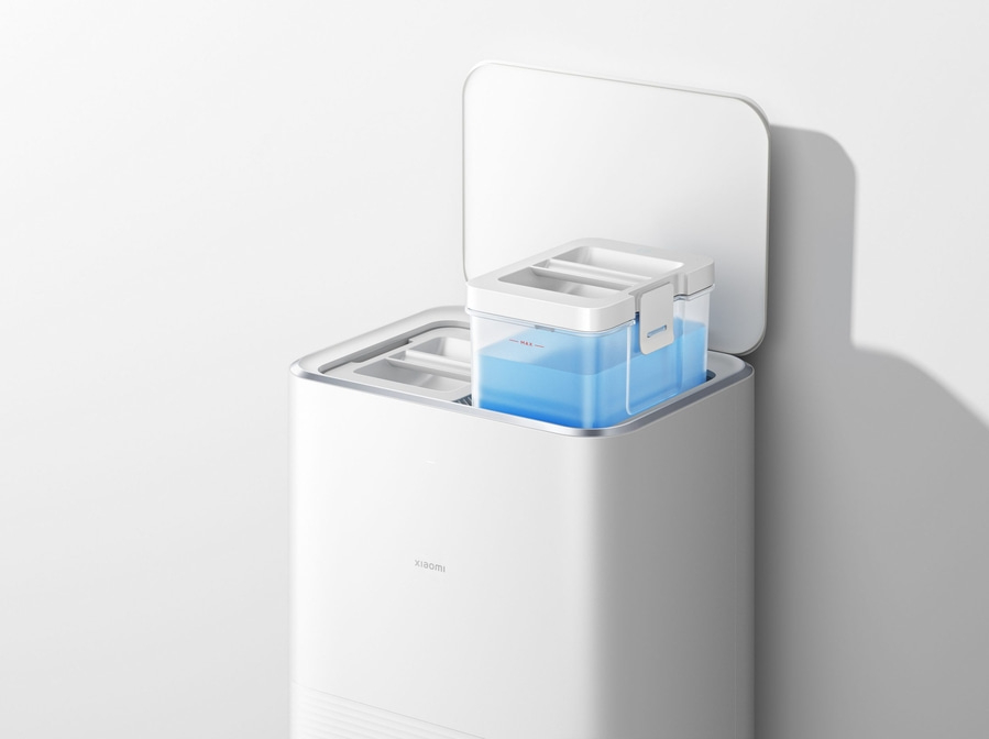 Weißes Gerät mit blauem Wasserbehälter, geöffnetem Deckel und Xiaomi-Logo.