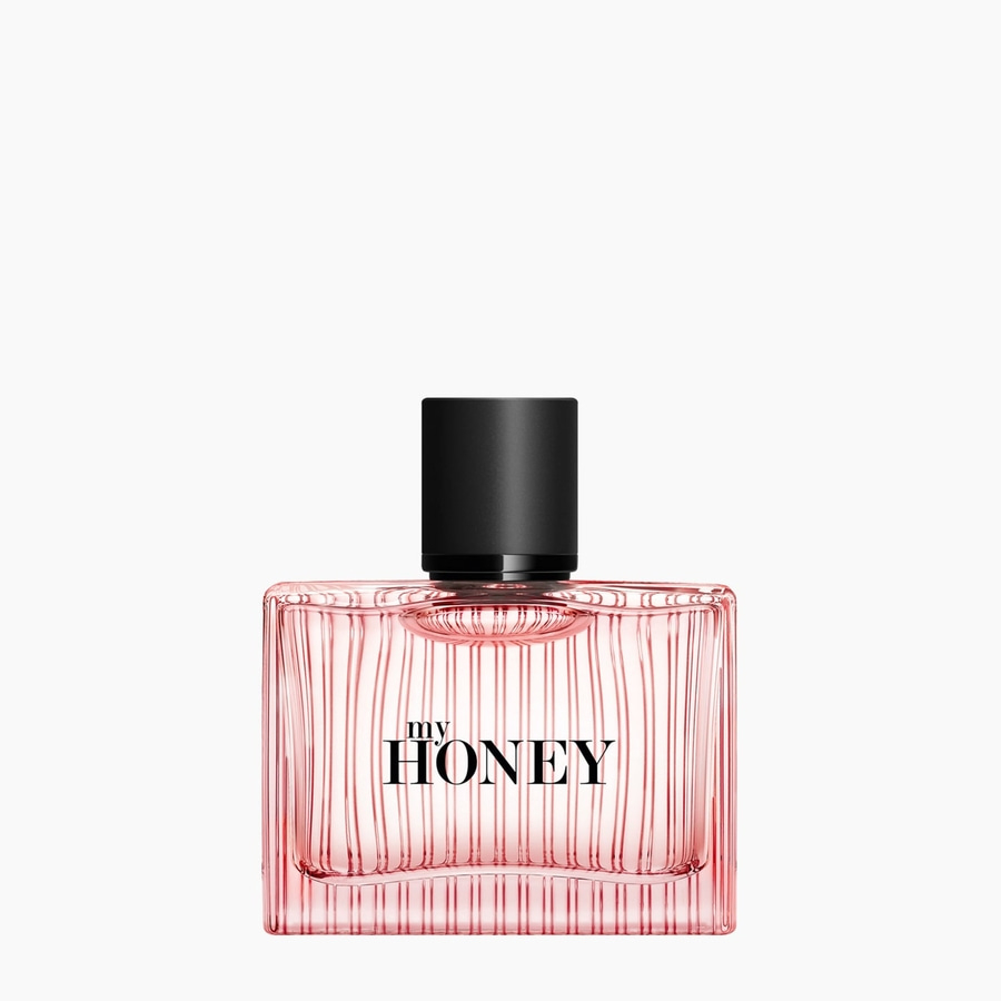 Parfümflasche mit rosa Flüssigkeit und schwarzem Deckel, mit Aufschrift 'my HONEY'.