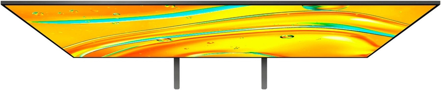 Ein gelb-oranges Fernsehgerät mit zwei Beinen und einem einzigartigen Design.