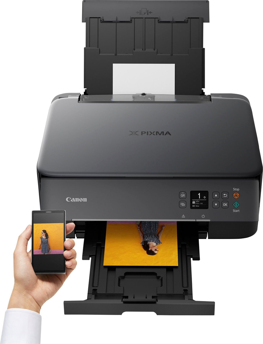 Canon Pixma Drucker mit Smartphone, das ein Foto zeigt, das gerade gedruckt wird.