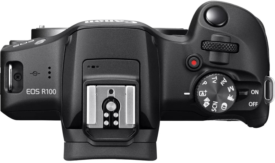 Canon EOS R100 Kamera, Draufsicht, schwarzes Gehäuse, Einstellrad, Blitzschuh, Ein/Aus-Schalter