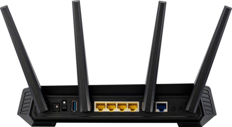 Ein schwarzer Router mit vier Antennen und vielen Anschlüssen.