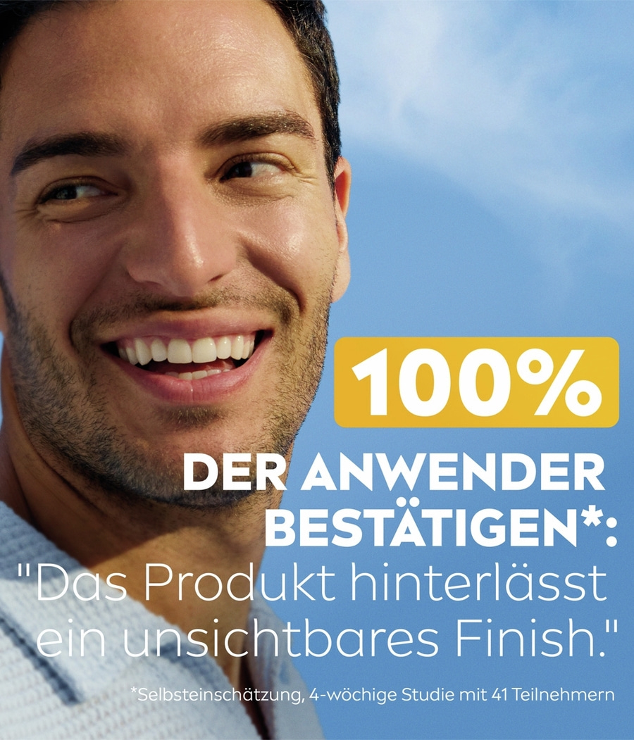 Ein Mann lächelt mit weißen Zähnen, 100% der Anwender bestätigen ein unsichtbares Finish.
