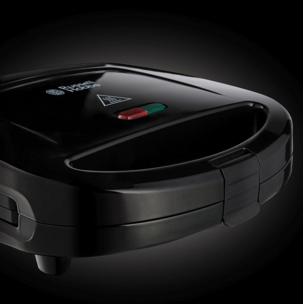 Schwarzer Sandwichmaker mit roter und grüner Anzeige und Russell Hobbs Logo.