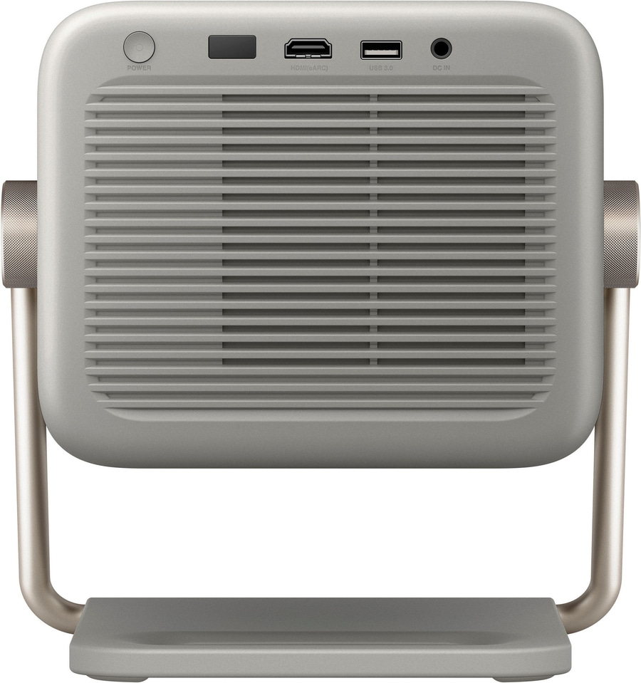 Ein silberner Projektor mit Lüftungsschlitzen und Anschlüssen.