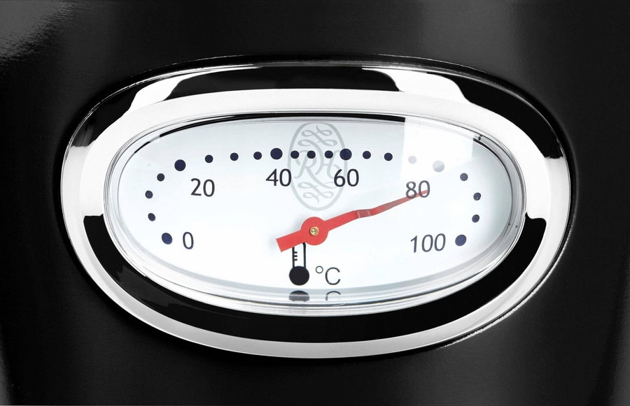 Thermometer zeigt 80 Grad Celsius an, eingebettet in ein schwarzes Gehäuse mit Chromrahmen.