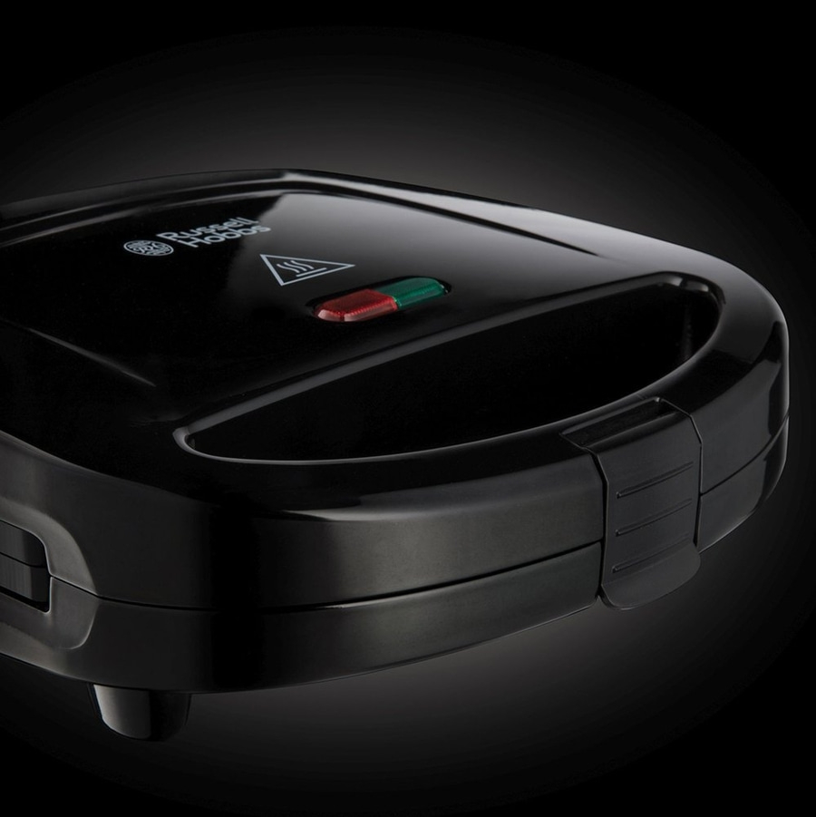 Schwarzer Sandwichmaker mit roter und grüner Anzeige und Russell Hobbs Logo.