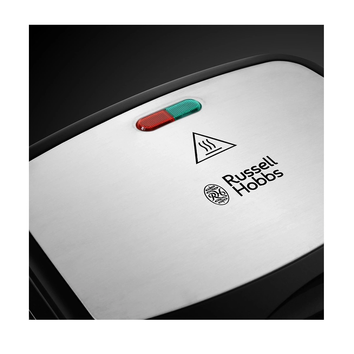 Nahaufnahme eines silbernen Geräts mit roter und grüner Anzeige und Russell Hobbs Logo.