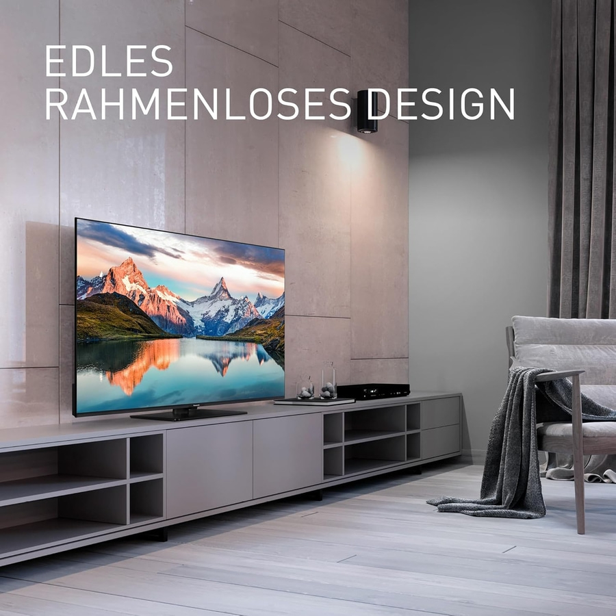 Edles rahmenloses Design. Fernseher im Wohnzimmer. Moderne Einrichtung mit TV-Gerät.