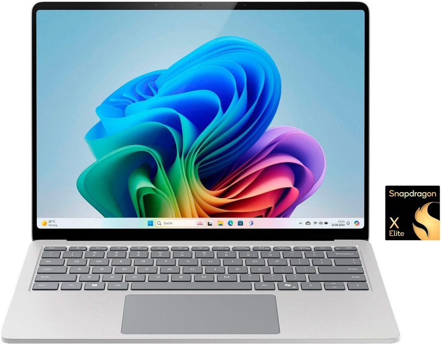 Laptop mit Snapdragon X Elite Prozessor, Windows-Oberfläche, Tastatur und Bildschirm mit bunten Farben.