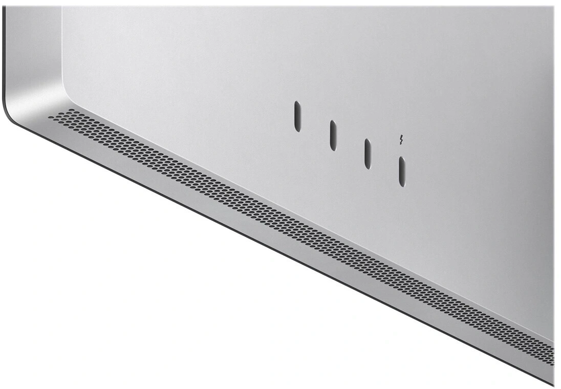 Nahaufnahme eines silbernen Computers mit Lüftungsschlitzen und Anschlüssen.