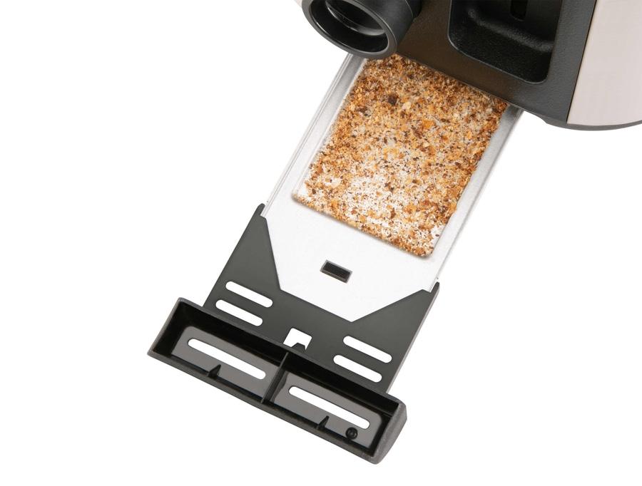 Nahaufnahme eines Toasters mit Krümeln in der Krümelschublade