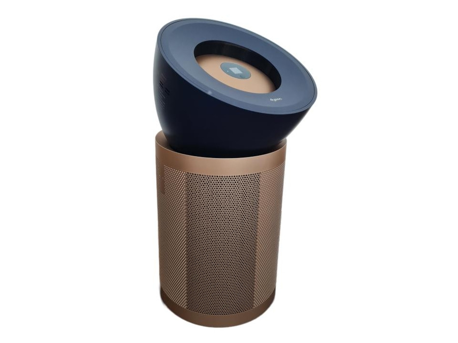 Ein zylindrischer Luftreiniger mit einem dunkelblauen oberen Teil und einem bronzefarbenen perforierten unteren Teil.