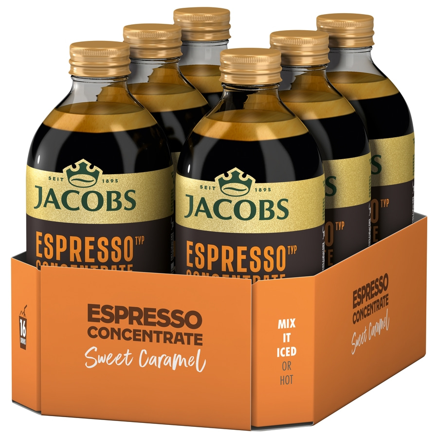 Sechs Flaschen Jacobs Espresso Konzentrat Karamell in einer orangefarbenen Verpackung.