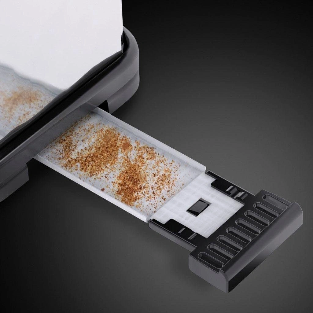 Nahaufnahme eines Toasters mit herausgezogener Krümelschublade, gefüllt mit Krümeln.